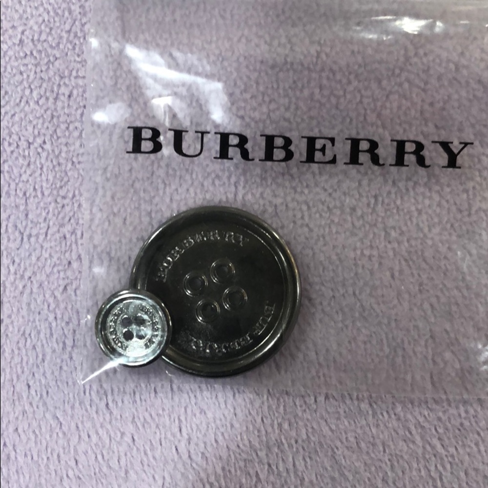 2 Burberry buttons